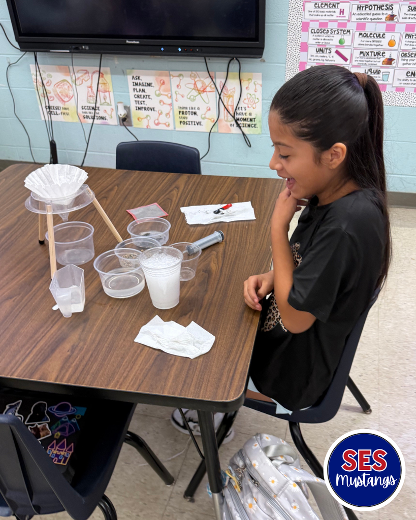 students working in groups with science equipment
