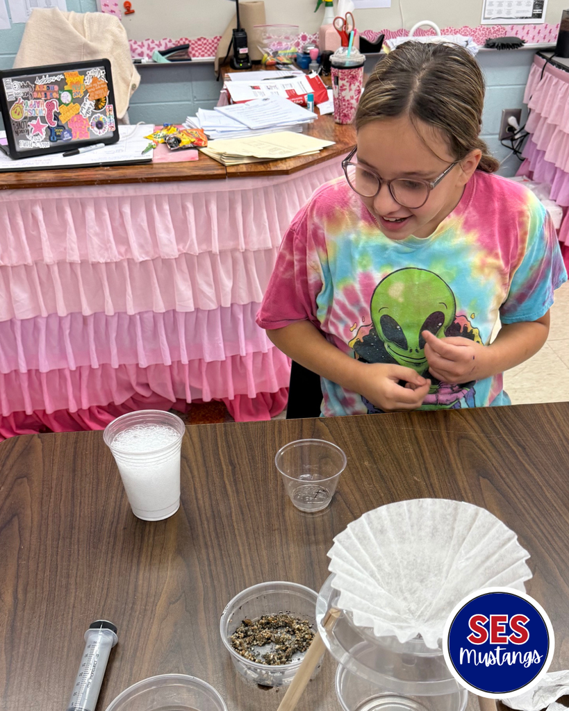 students working in groups with science equipment