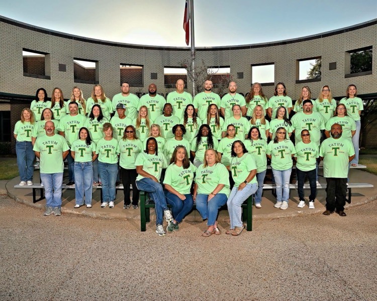 staff wearing green shirts 