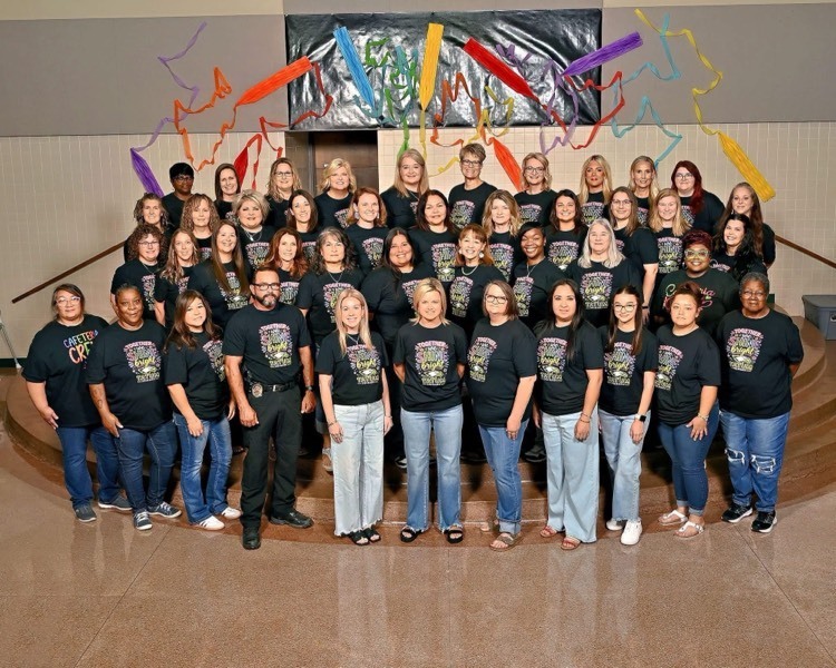 staff wearing black shirts