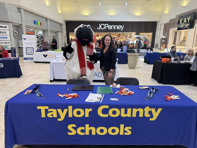 Dr. Decker standing with Snowbird at Job fair  
