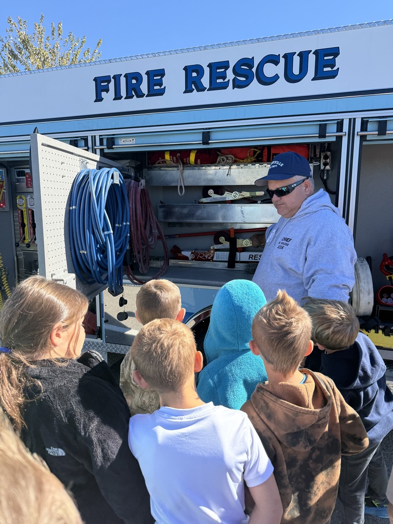 Students, firefighter, and fire truck 