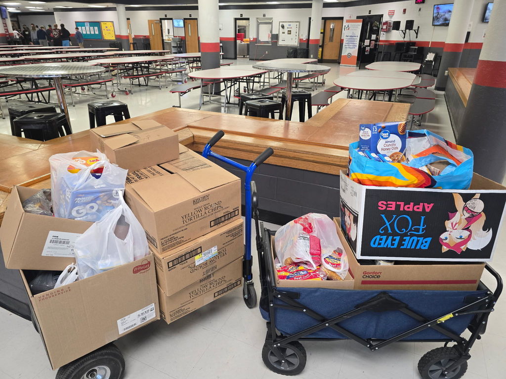 Boxes and bags of food being donated to local food banks