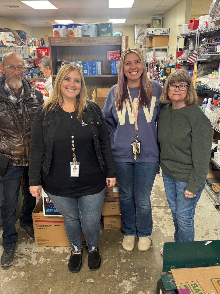 Taylor County Schools representatives providing donated food to local food banks