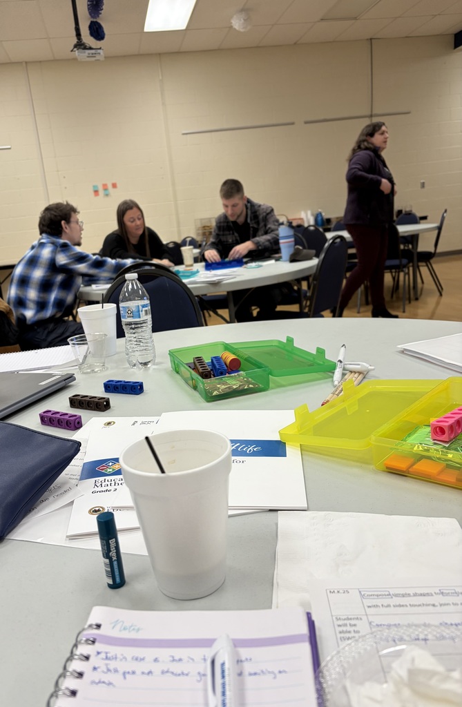 Teachers working with math tools to solve problems