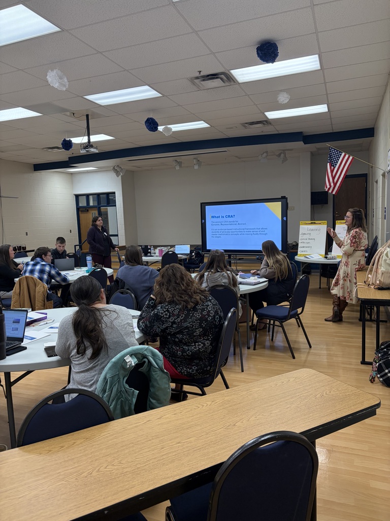 Teachers sitting and listening to the presenter