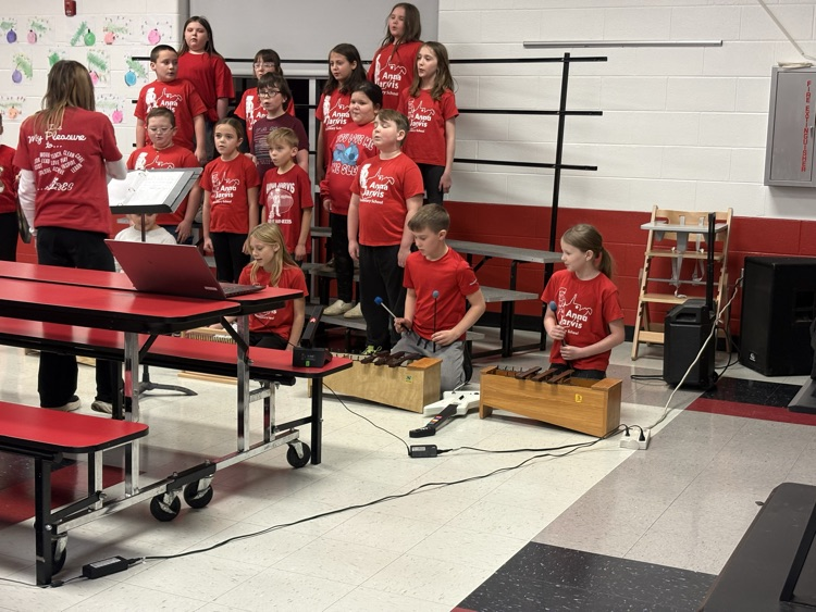third grade students performing