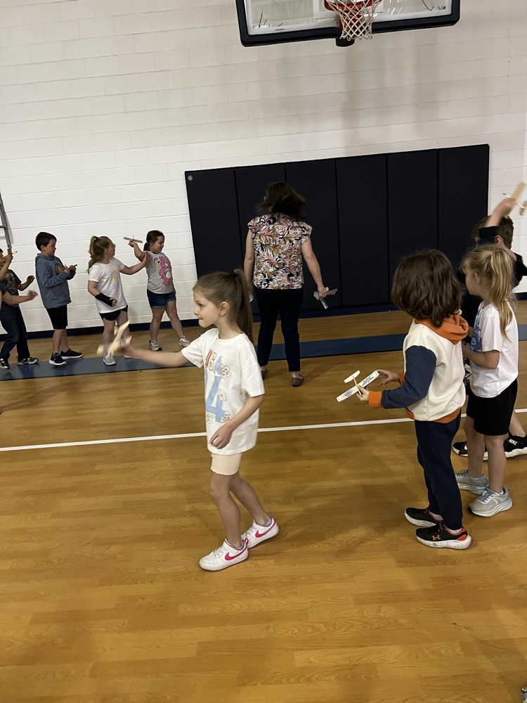 Students with model airplanes