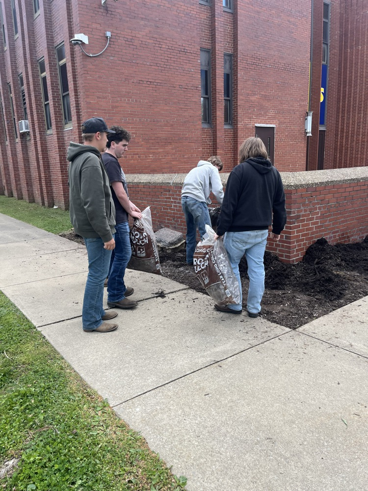 Bearcats at work! GHS Students mulching the front of the school