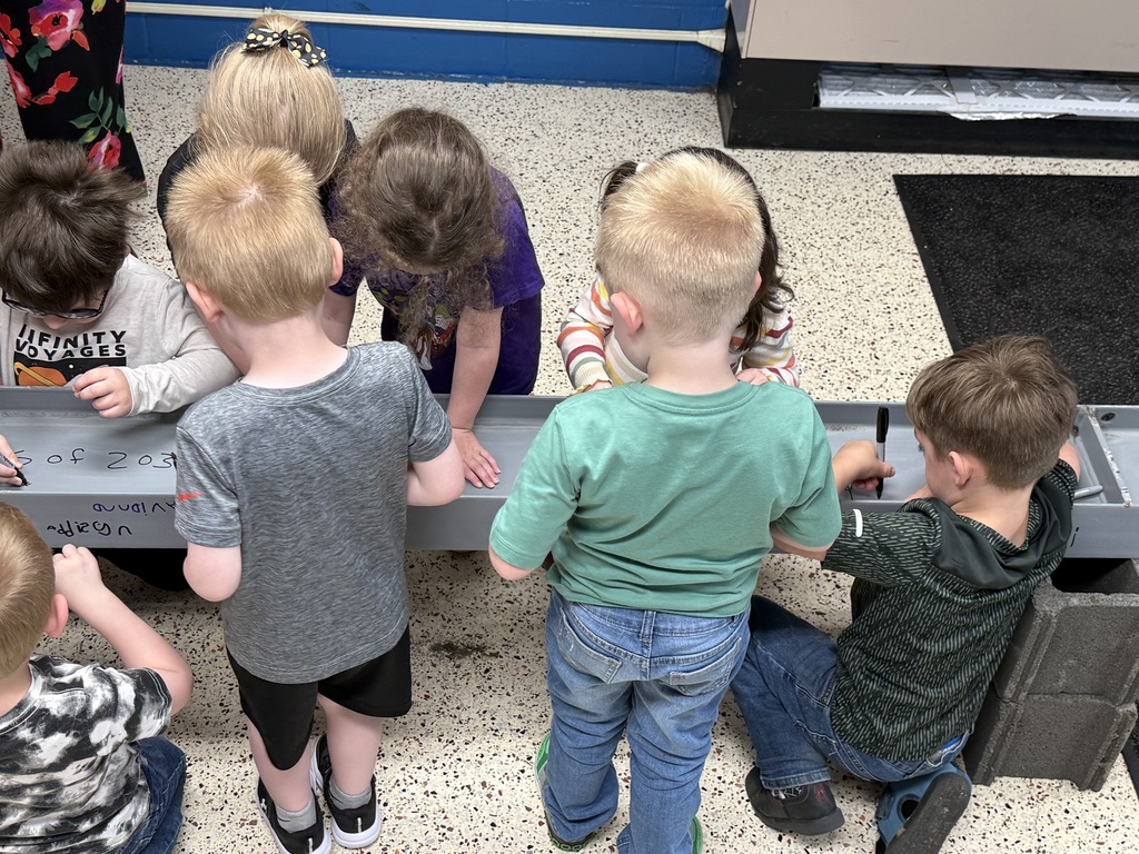 Students signing I-beam .