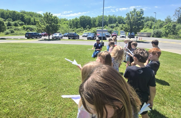 Students getting instructions about launching their rockets.