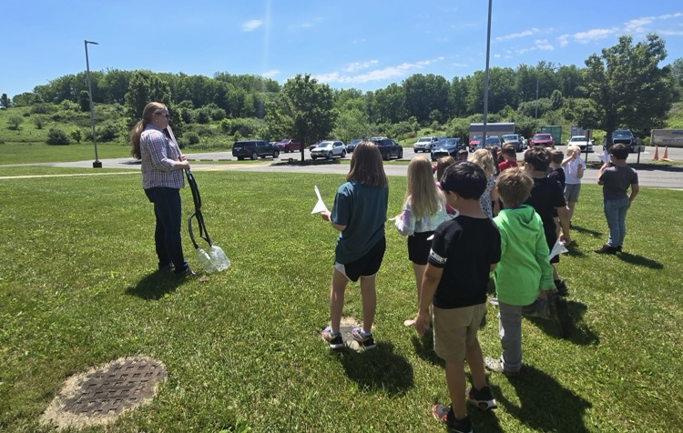 Students getting instructions about launching their rockets