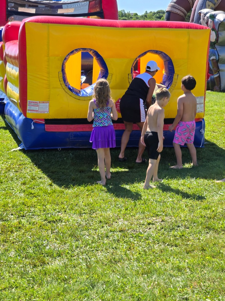 Students going on a bouncy obstacle course