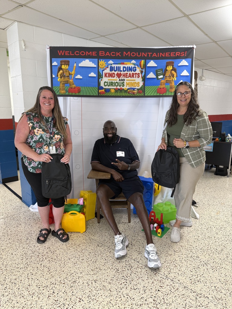 Picture of principal with backpacks