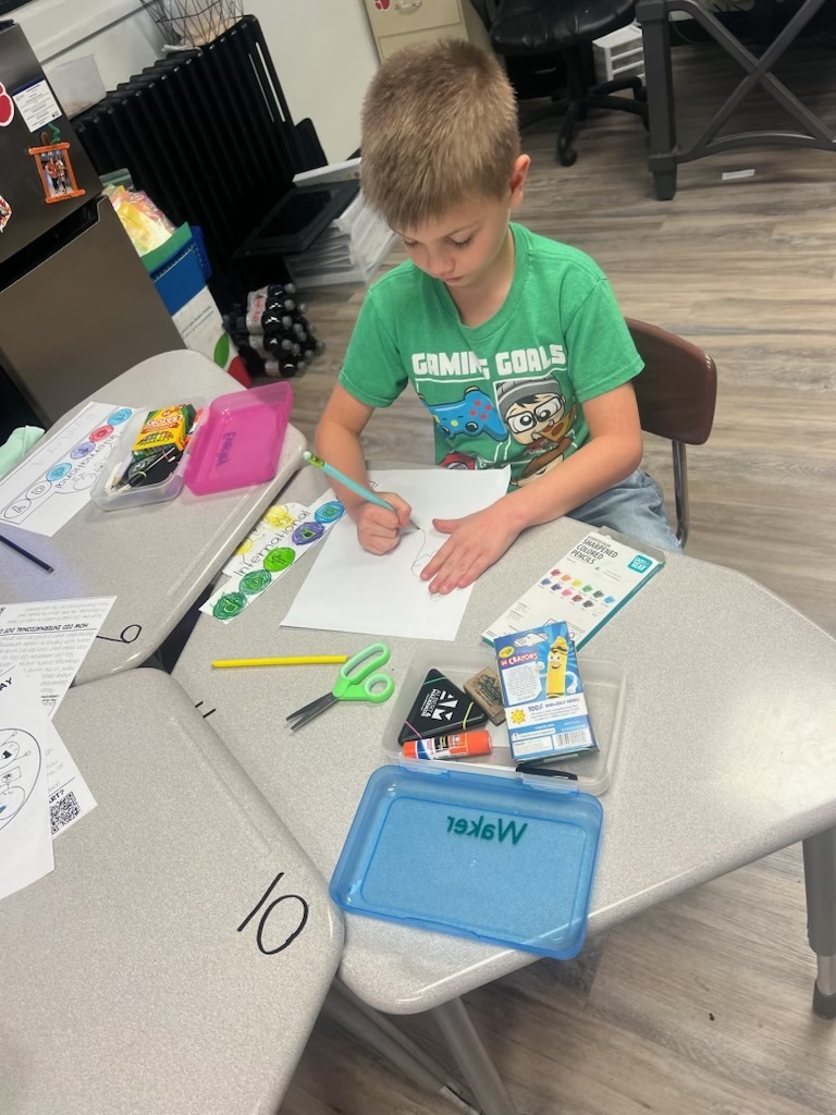 Student designs a dot.