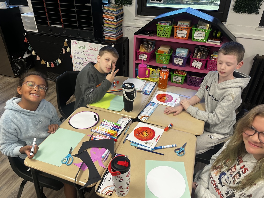 Students decorate a dot.