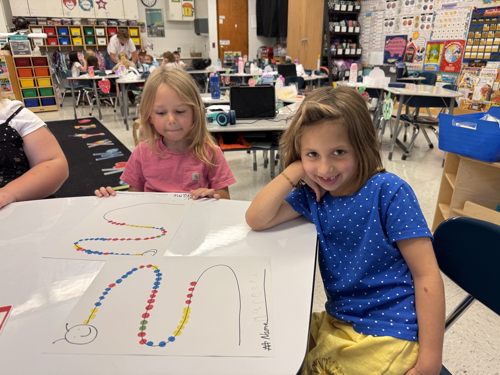 Students create dot patterns in math.