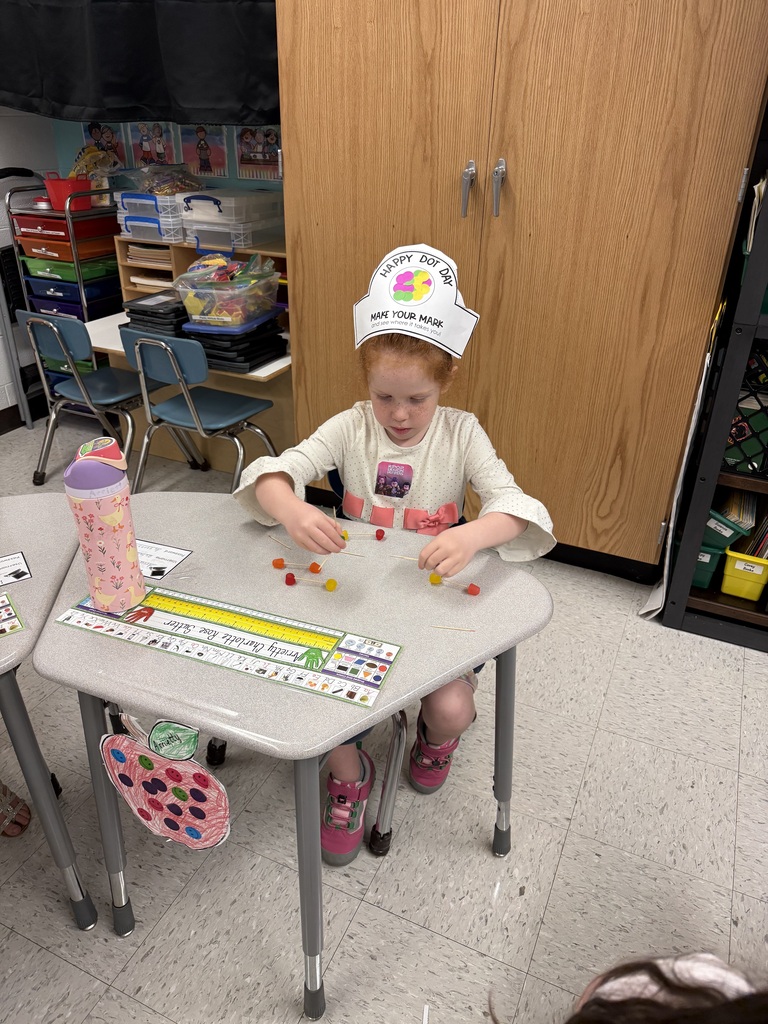 Student creates a shape with toothpicks and gummy dots.