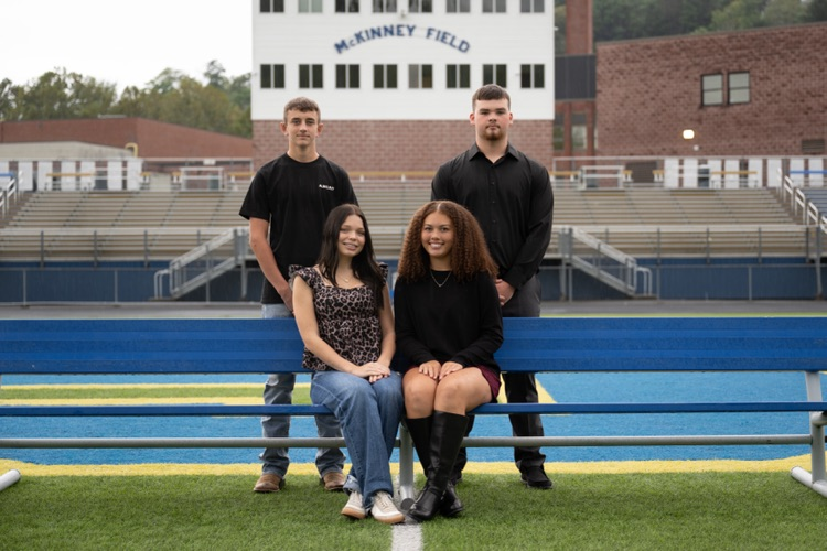 Photograph on McKinney field of the Junior Class princesses and their escorts