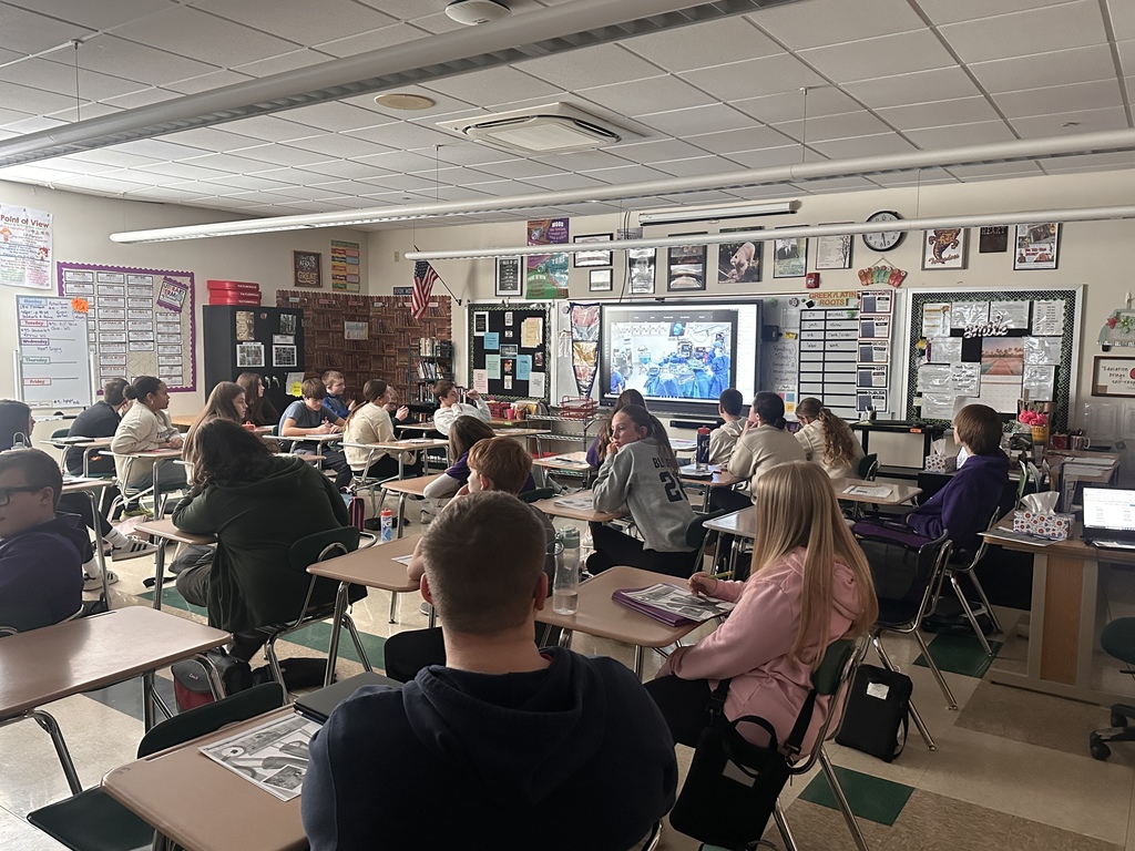 8th grade students viewing procedure in Mrs. Alberssen and Ms. Graves room