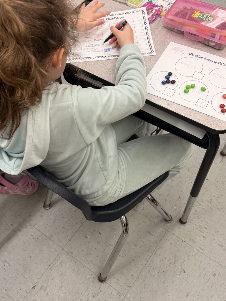 Mrs. Dye's class sorting and graphing skittles by color.