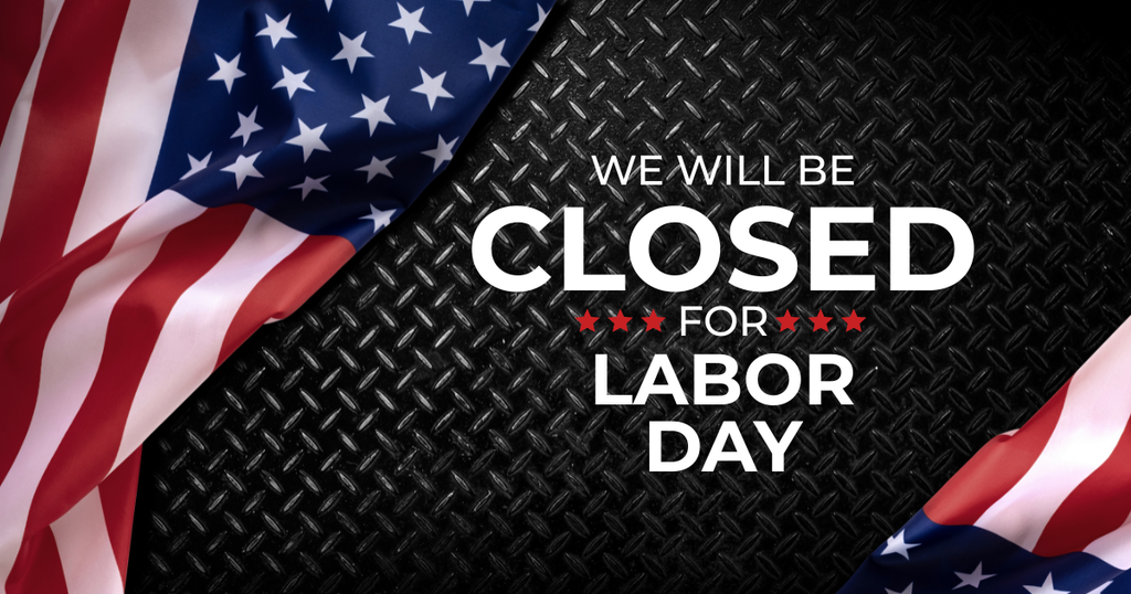 Two American flags on a black metal texture background. Text reads, "We will be closed for Labor Day."