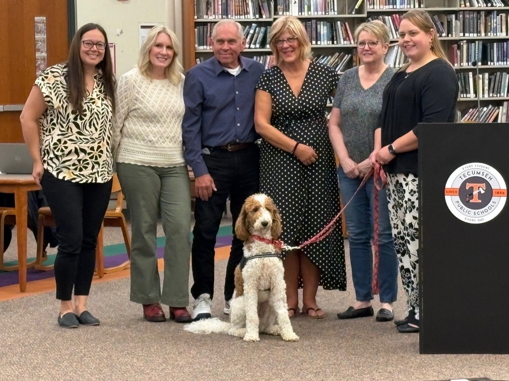 On Monday night, Daisy was officially recognized at the Board of Education meeting as the newest member of our Tecumseh Middle School tribe! With her wagging tail and caring heart, Daisy plays a very important role in helping our students feel safe, calm, and supported throughout their school day. We are so grateful to the incredible community partners who made Daisy’s journey to TMS possible: 🐾 Katherine Whelan (Whelan Insurance Agency) – donation of Daisy 🐾 Deb Followell & Nicole Farrell – Daisy's daily handlers with specialized training 🐾 Dr. Major (Companion Animal Clinic) – veterinary care 🐾 Grace Roberts (Wags to Whiskers) – supplies, food, toys & treats 🐾 Ron Publiski & Tracy Hendrick (Kiwanis Youth Committee) – coat, patches & incidentals 🐾 Ava Salbien (Pooch Parlor) – grooming services 🐾 Mary Tommelein – community supporter 🐾 Vicki Riddle – Daisy’s vest Welcome, Daisy—you’ve already stolen our hearts! 🐶