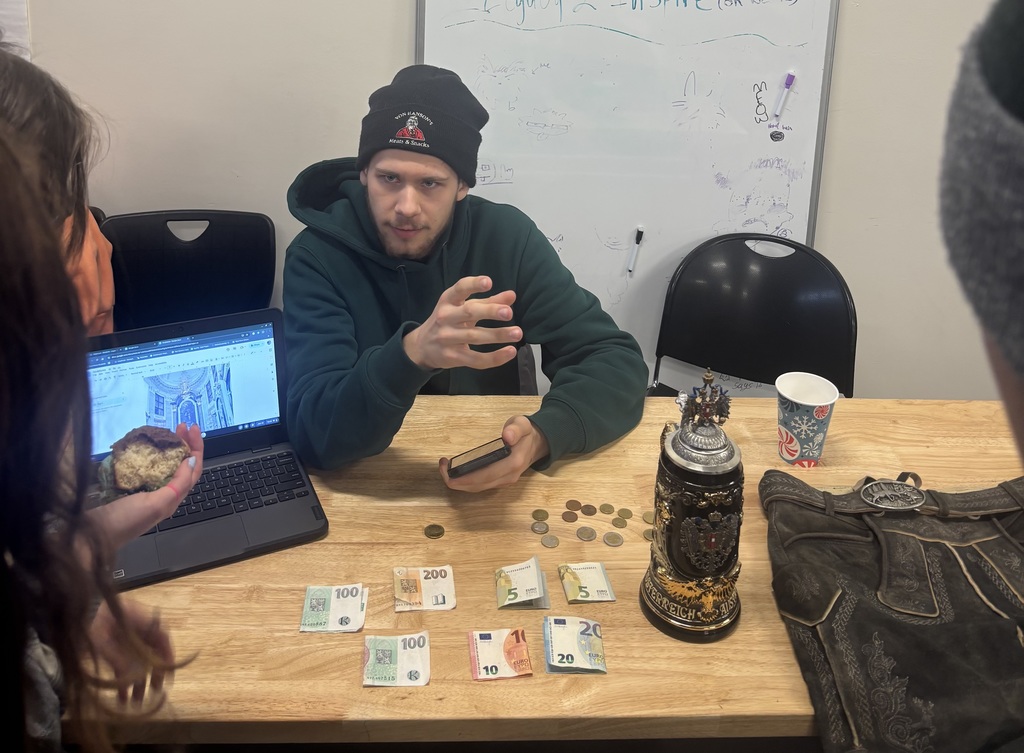 Student shows objects collected from travels