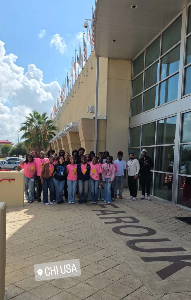 Group photo of LMHS cosmetology and barbering students outside of Farouk professional salon business.