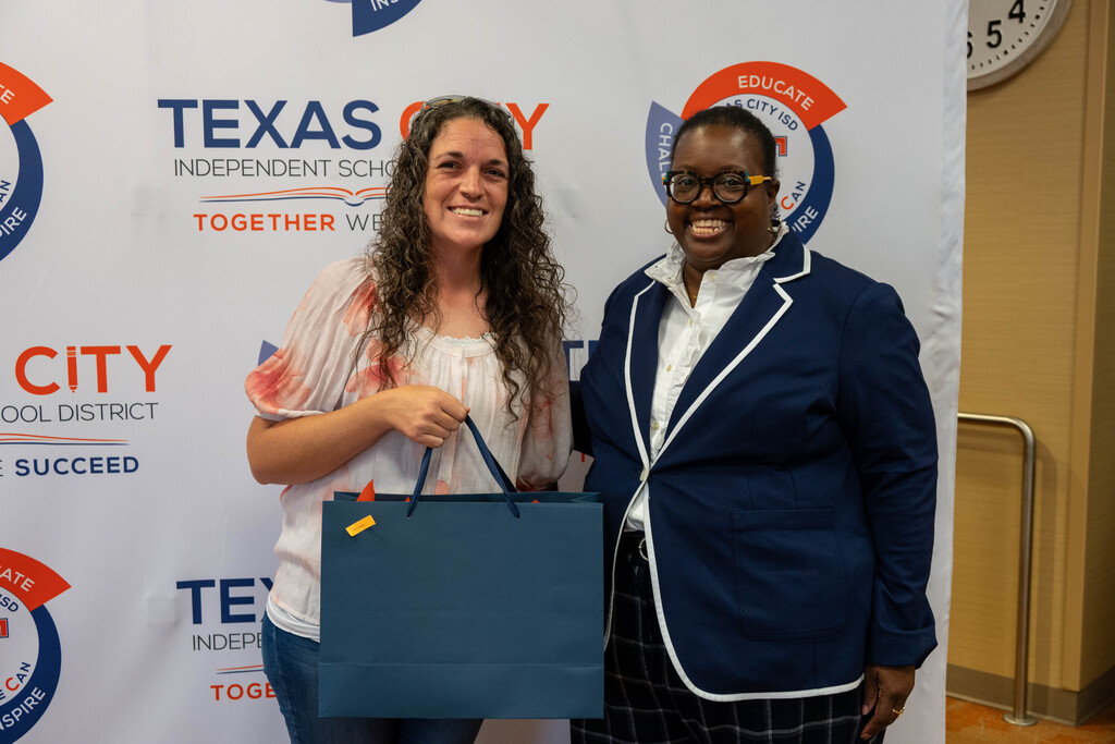 TCISD Quarterly Champion pose with certificates alongside Board President Nakisha Paul.