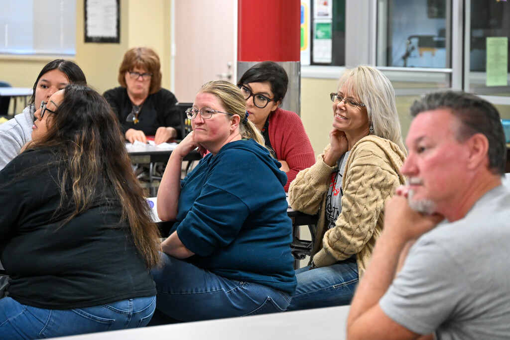 Heights Elementary staff members listen and smile during the school’s 2026 Lone Star Ribbon School announcement.