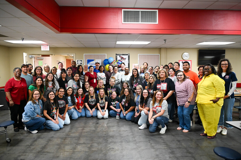 Heights Elementary staff and district leaders pose together in the cafeteria after the school was named a 2026 Lone Star Ribbon School.