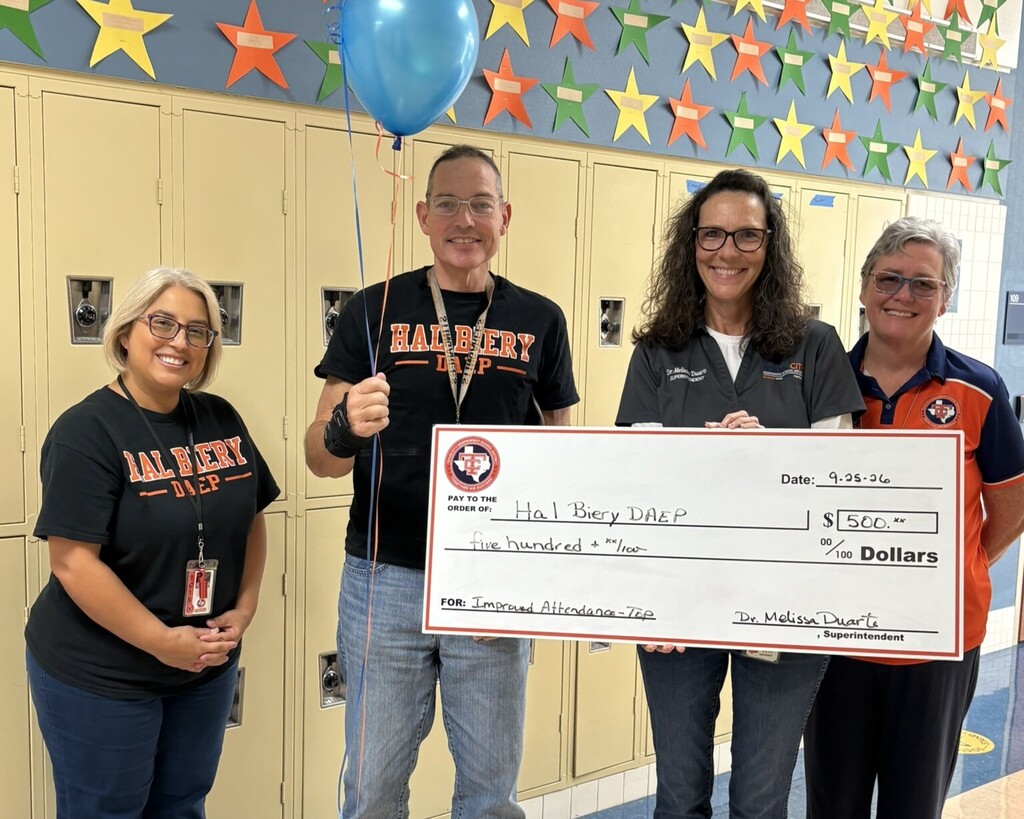 Hal Biery staff celebrate receiving a most improved attendance award.