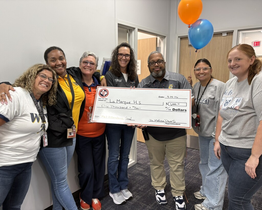 La Marque High School staff celebrate meeting their attendance goal.