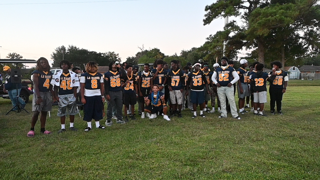 The football players at the Homecoming Pep Rally