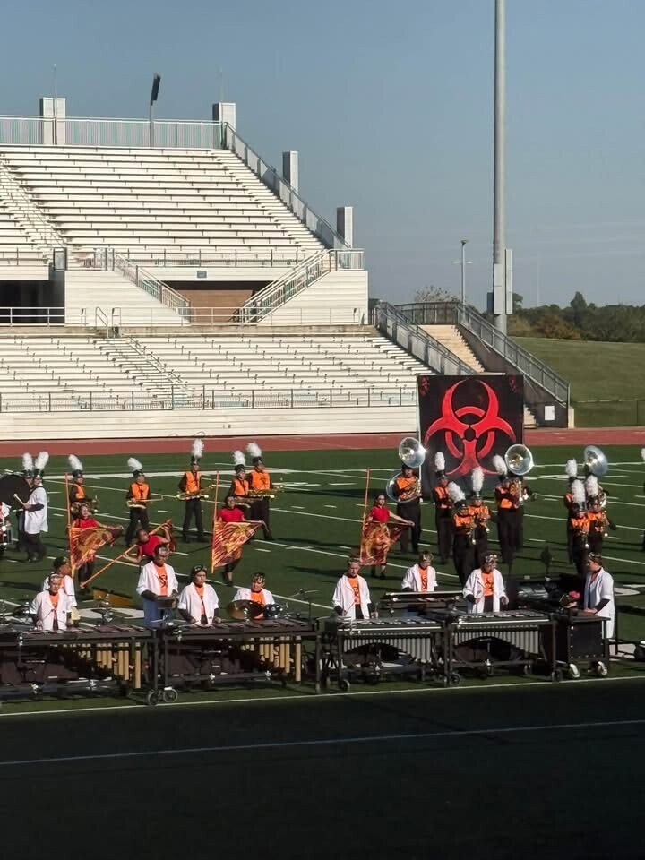 Band members during their routine at Challenger Stadium
