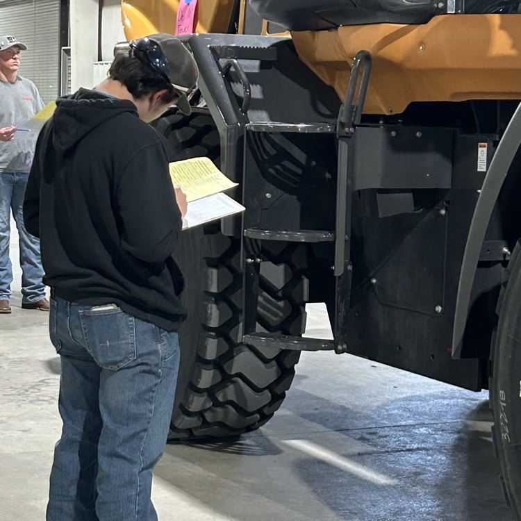 Cooper working from the manual