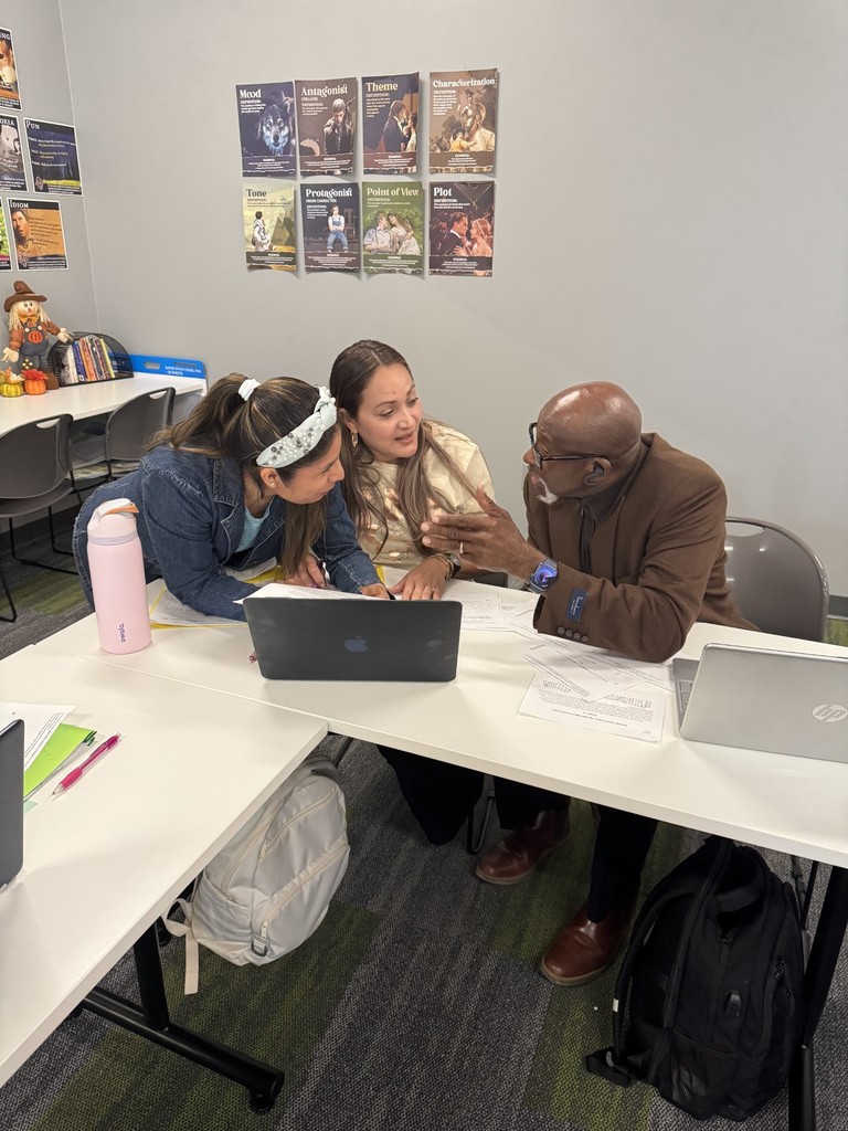 Photo of students working together in class