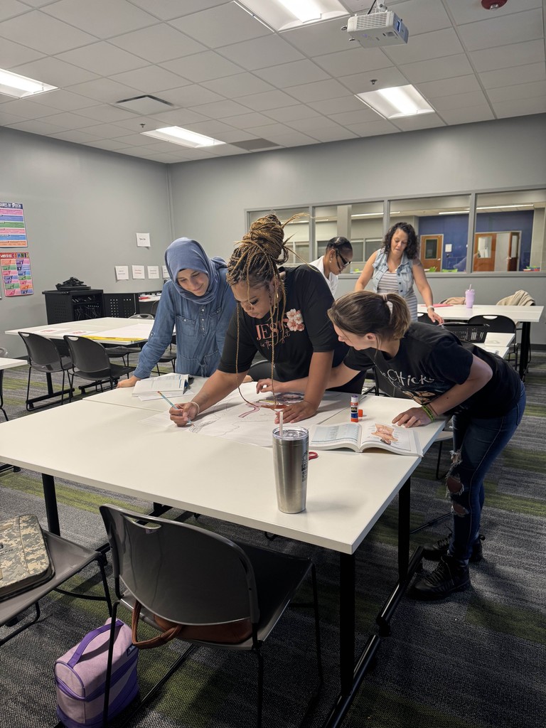 Photo of students working together in class