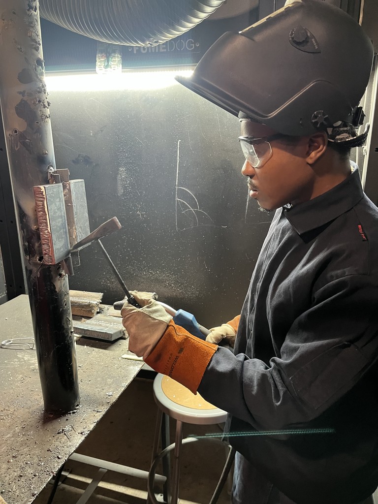 This student is working on a welding skill. 