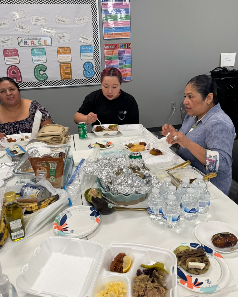 Students eating food brought for the class