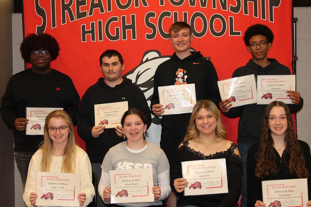 photo of students holding certificates