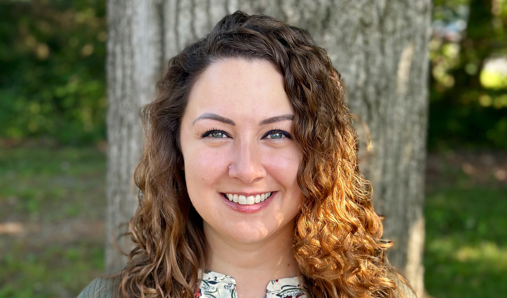 woman in curly hair smiling