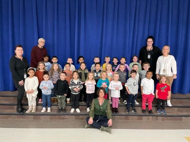 Teachers and students posing for photo