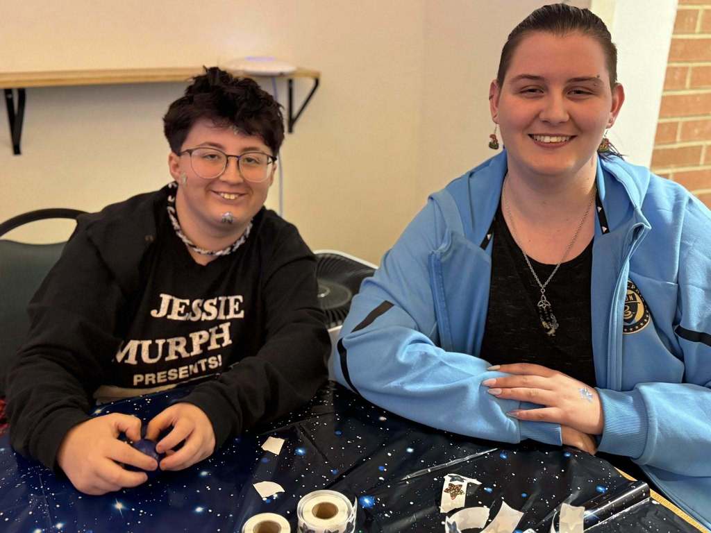 Staff members smiling