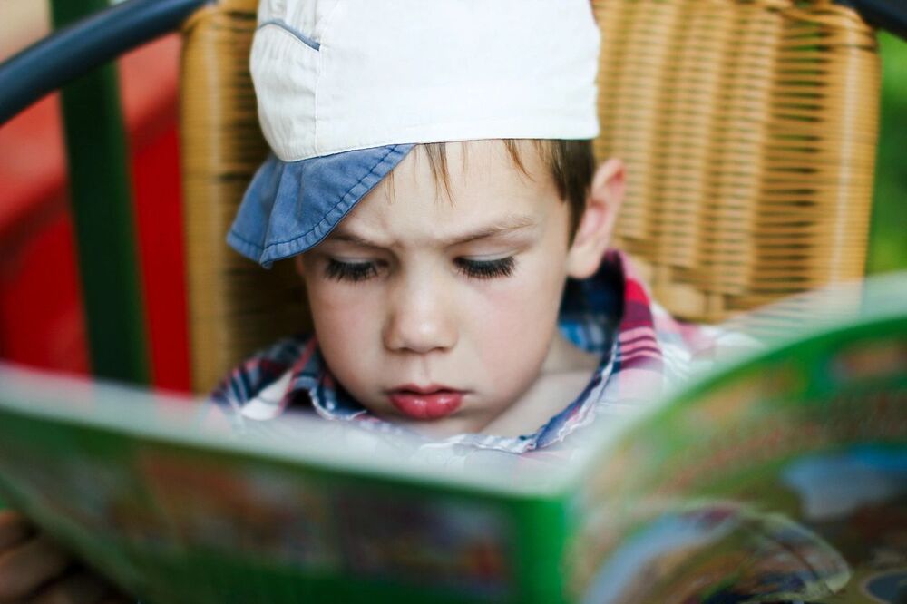 kid reading a book