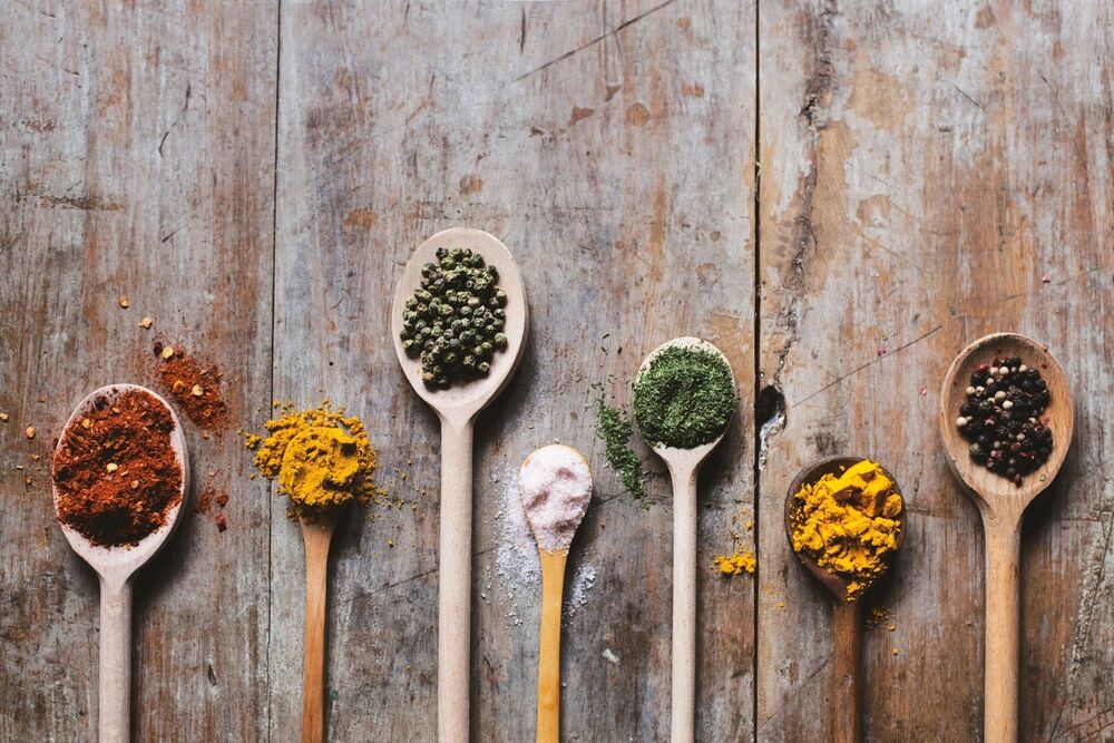 wooden spoons with different ingredients