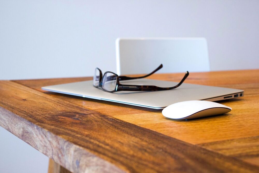 glasses on top of computer