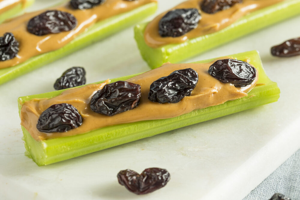 Celery sticks topped with peanut butter and raisins.