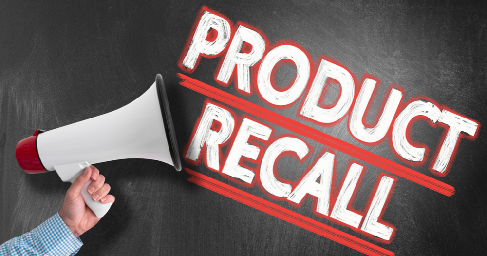 hand holding megaphone with works Product Recall
